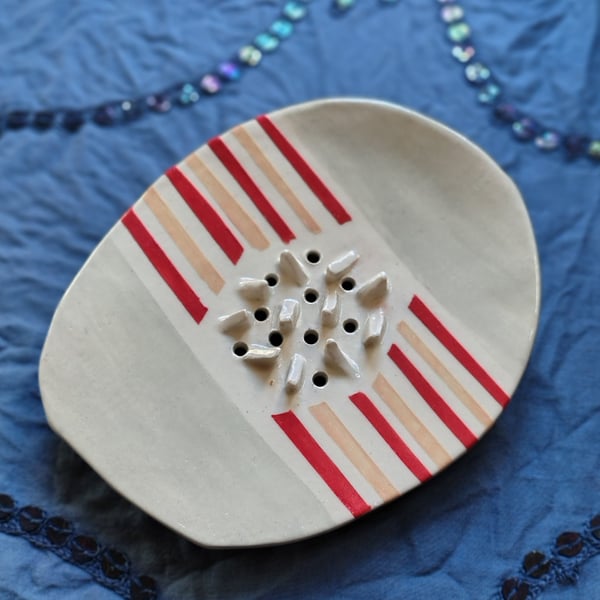 Ceramic soap dish with pastel red and peach stripes