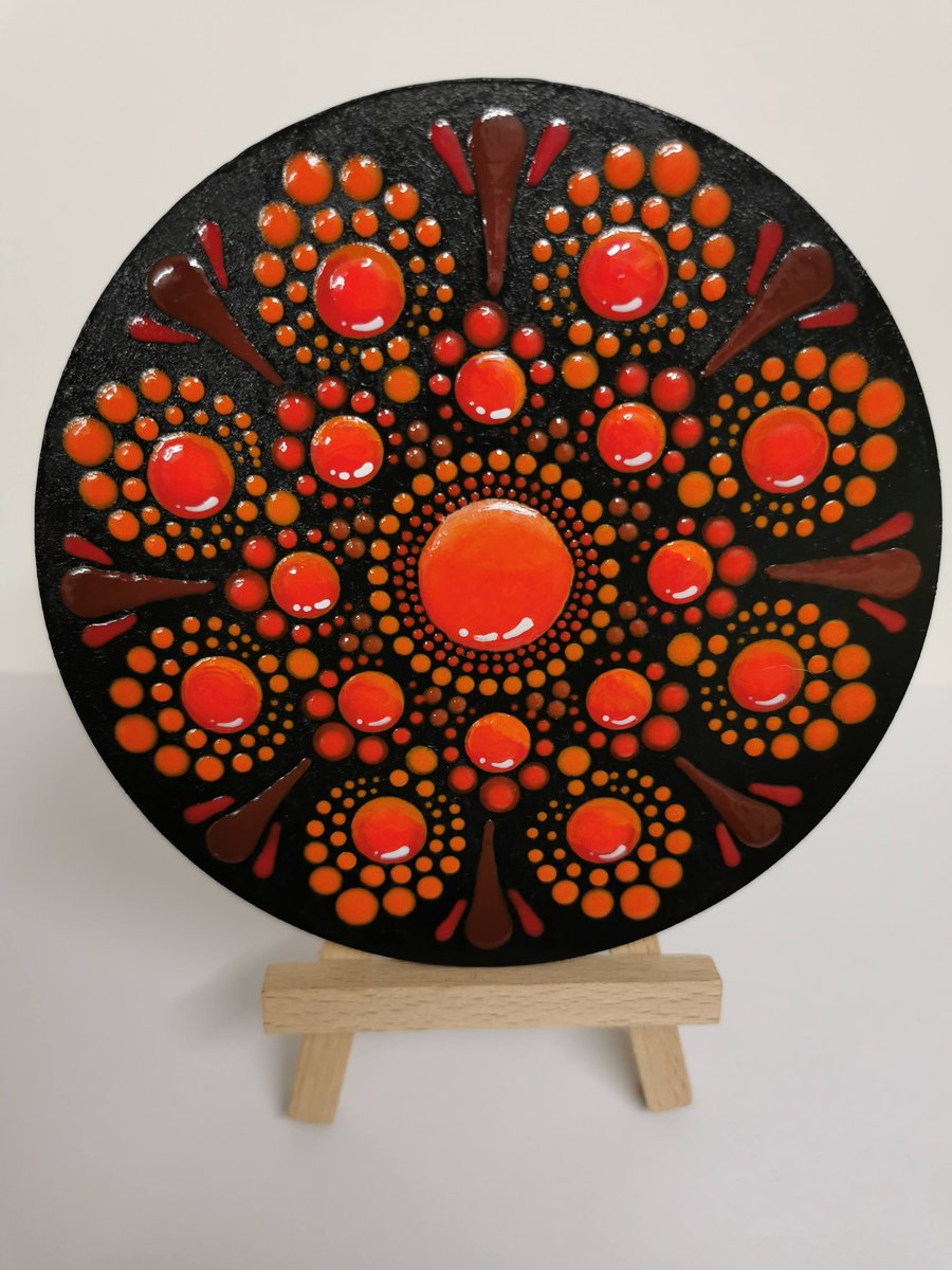Hand painted red and orange mandala coaster