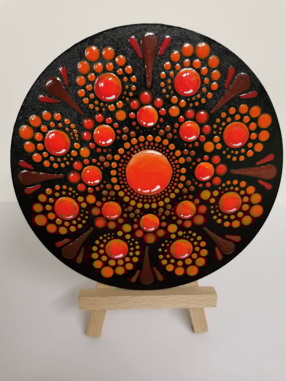 Hand painted red and orange mandala coaster