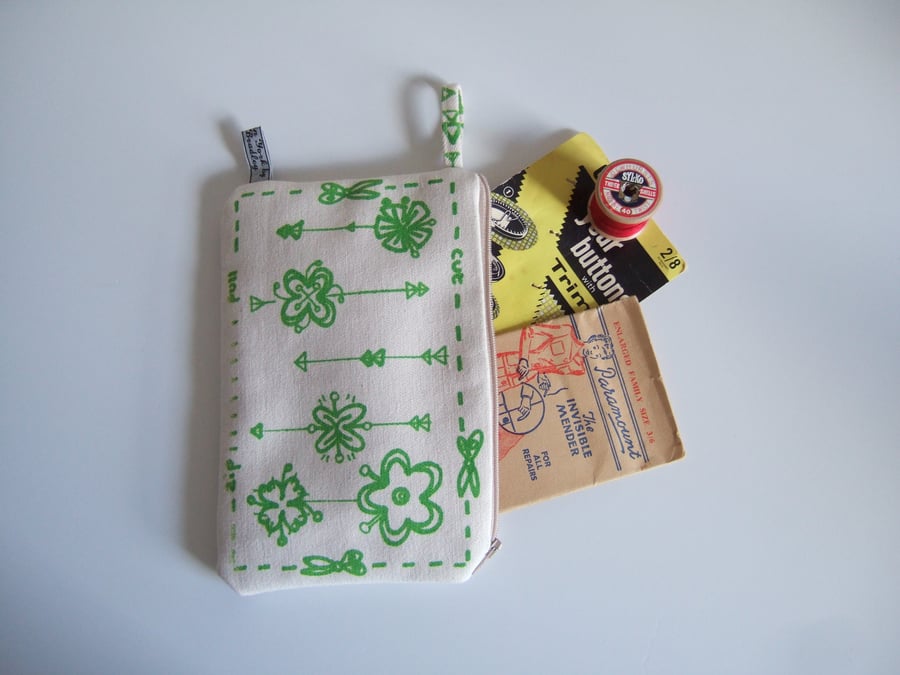 Green hand screen printed cosmetics, make up bag or purse. 