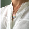 A Rainbow pendant to spread joy and hope. 