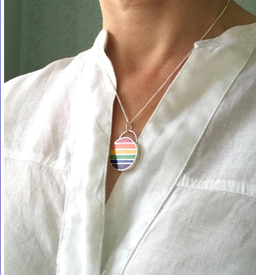 A Rainbow pendant I’m resin and sterling silver