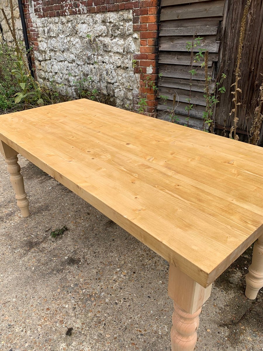 Farmhouse Style Dining Room Table constructed our of reclaimed timber