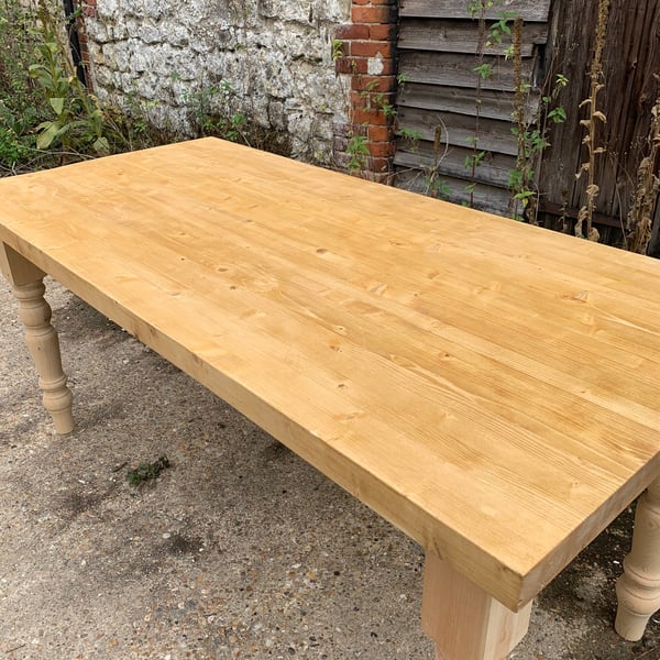 Farmhouse Style Dining Room Table constructed our of reclaimed timber