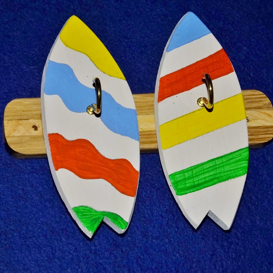  Key rack or holder with two brass hooks on colourful surfboards or bodyboards.