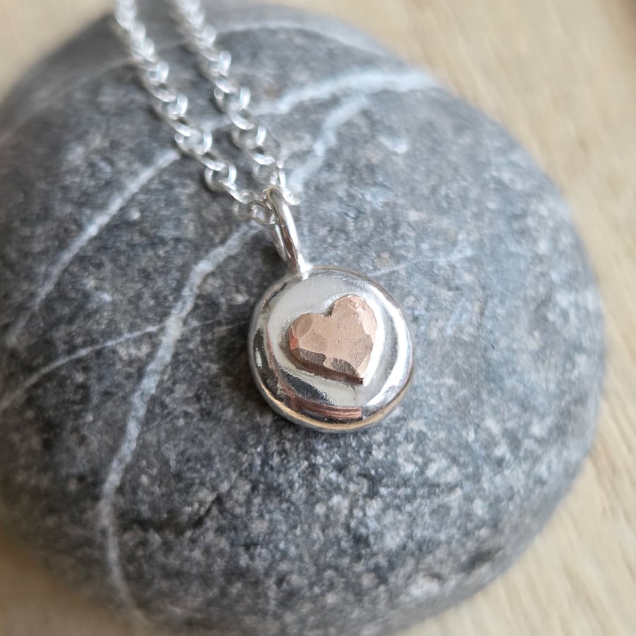 Sterling silver pebble pendant with bronze heart, Small silver nugget necklace