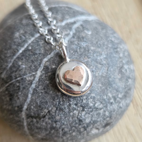 Sterling silver pebble pendant with bronze heart, Small silver nugget necklace
