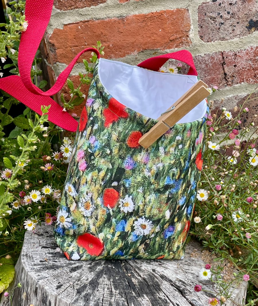 Shower-proof peg bag. Klimt-inspired design with red strap