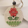 Ceramic decoration with flower button