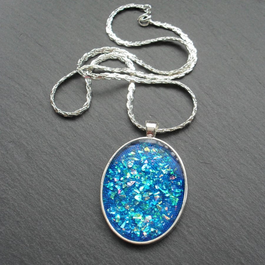 Blue Glitter Resin Pendant With Woven Silver Plated Chain