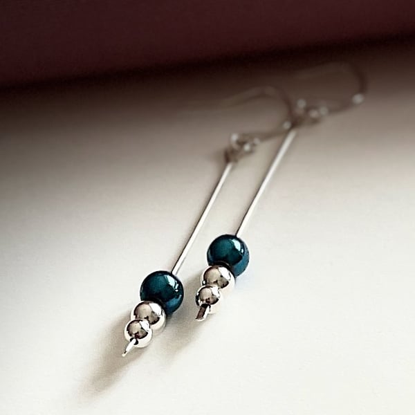 Bright blue and silver dangly earrings