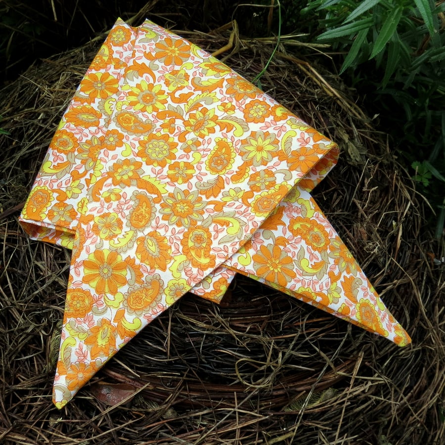 A dog bandana.  Size medium.  64cm x 23cm.  Groovy sixties flower power.