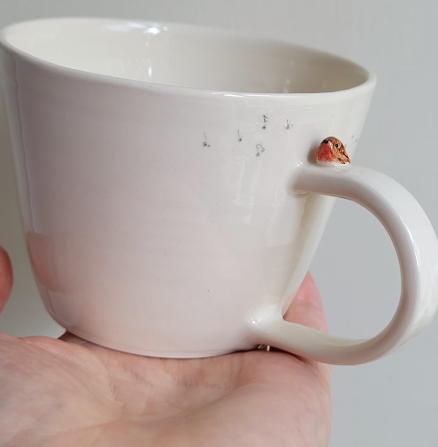 Hand thrown ceramic robin mug with tiny bird & footprints