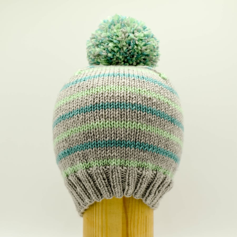 Hand knitted toddler hat in grey, green and turquoise stripes