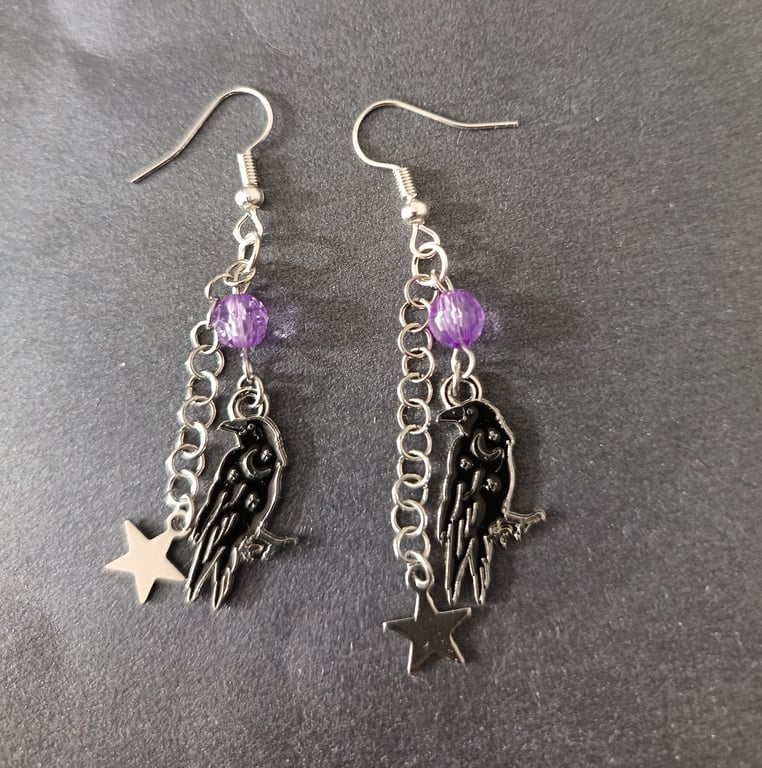 Gothic crow and star dangle earrings with purple bead detail