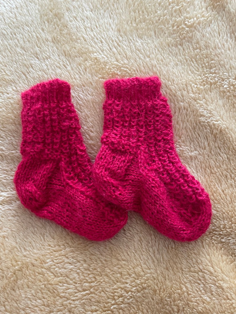Red socks for a young baby