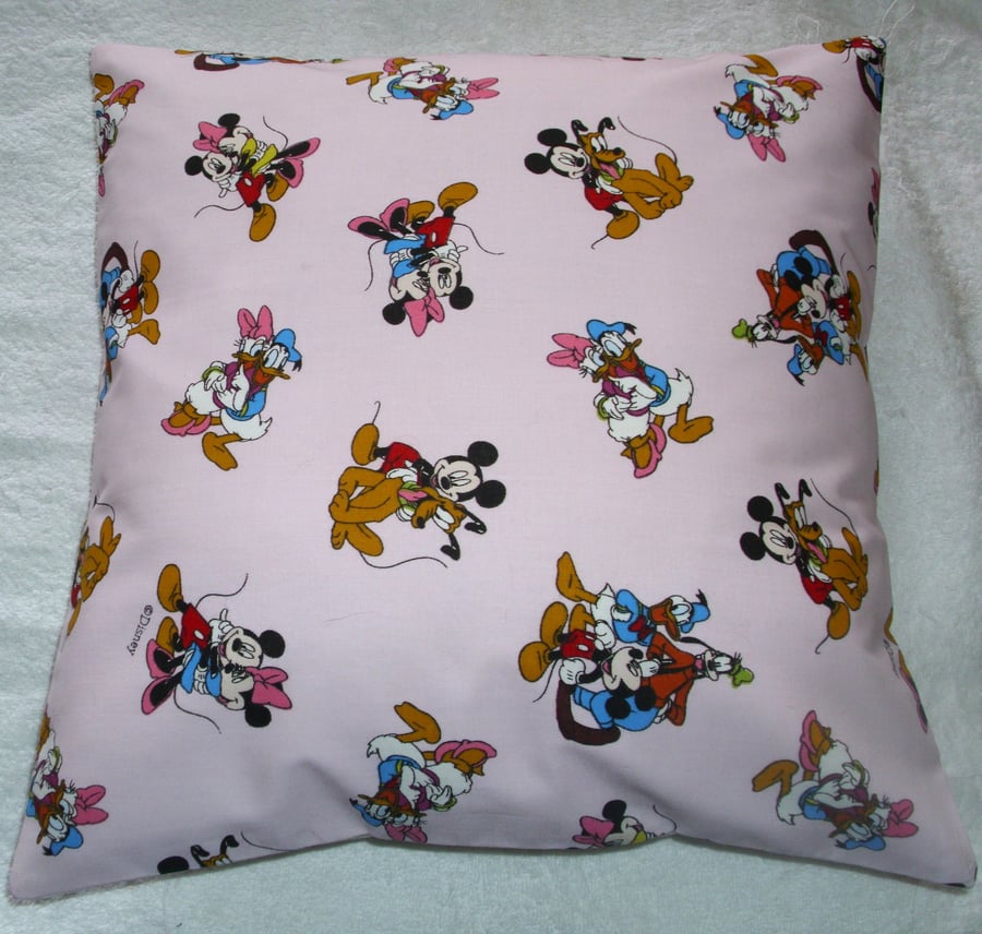 Mickey Mouse and Friends on a pink cushion