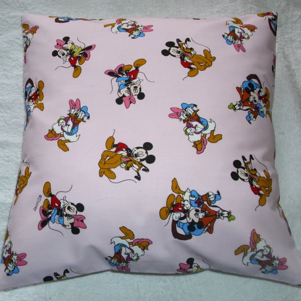 Mickey Mouse and Friends on a pink cushion