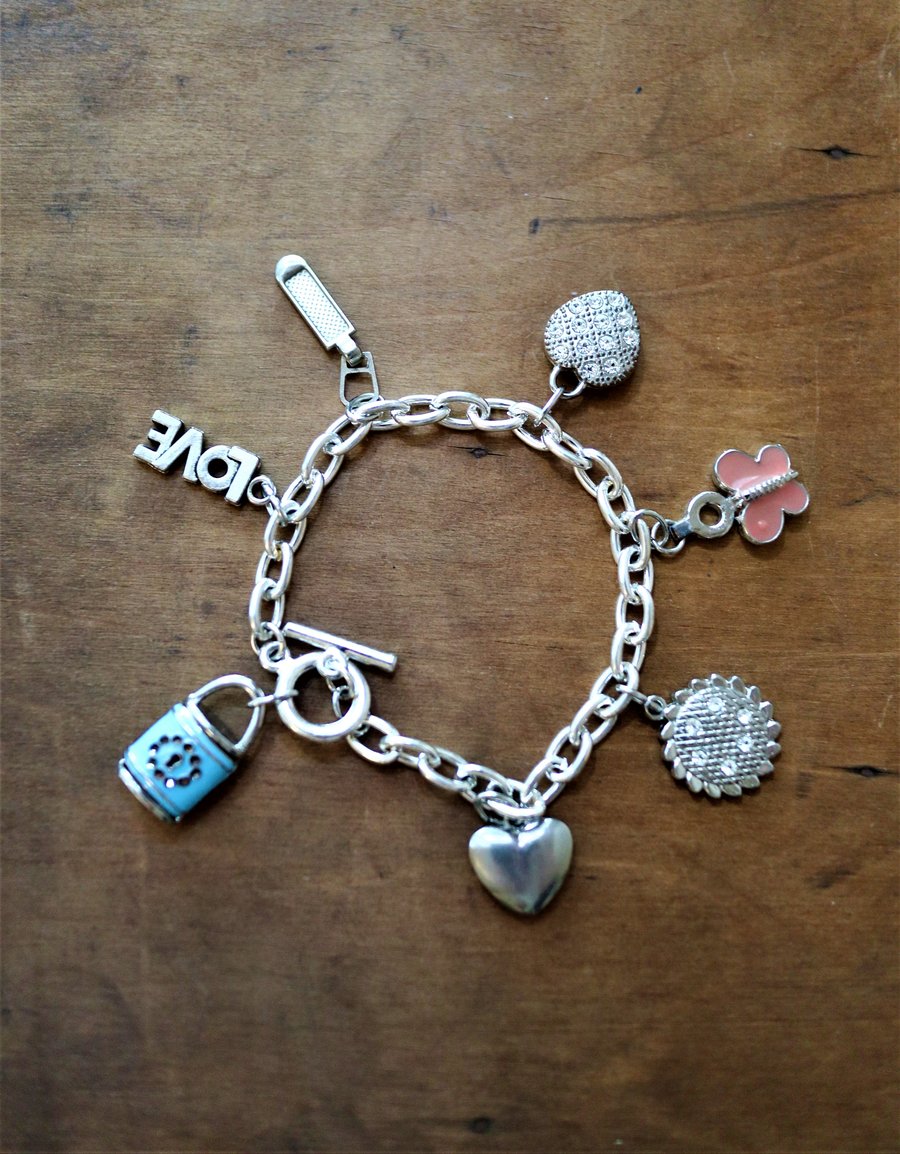 Up-cycled Vintage Heart and butterfly - LOVE and blue lock charms bracelet