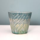 Handleless mug with geometrical pattern