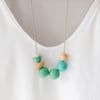 Maggie - Spring green coloured necklace, textured turquoise bead, hand painted