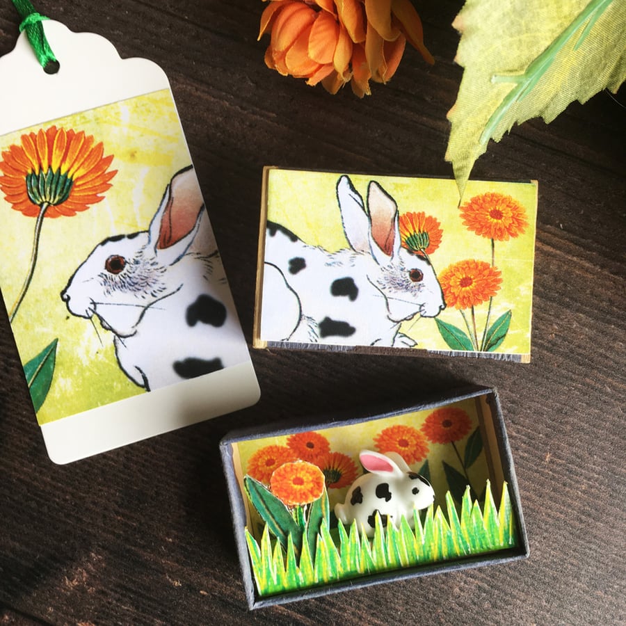 Matchbox art. Diorama – Dotty rabbit and marigolds.