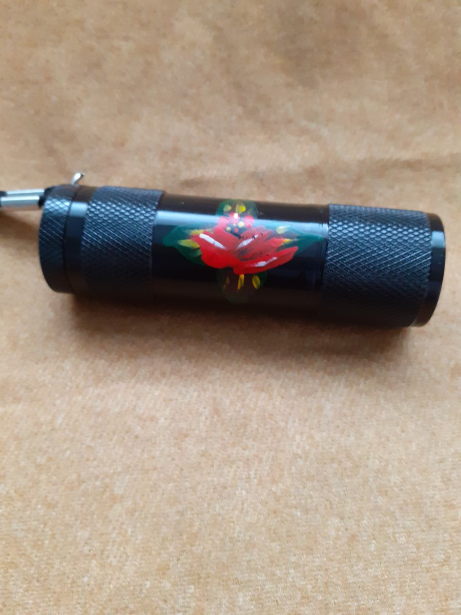 Black mini LED torch with red canal art style rose