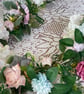 Handmade floral multi coloured, multi flowered garland table decoration. - Image 1