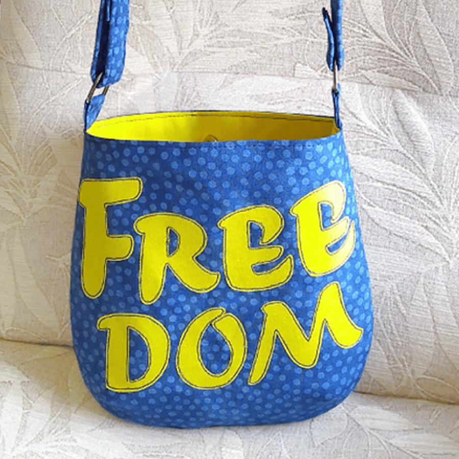 Blue spot ‘FREEDOM’ crossbody bag with adjustable strap