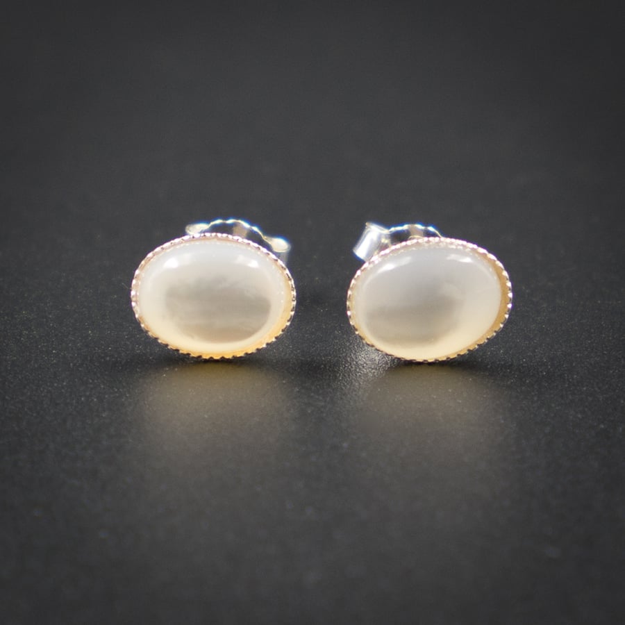 Cream mother of pearl   and sterling silver stud earrings 