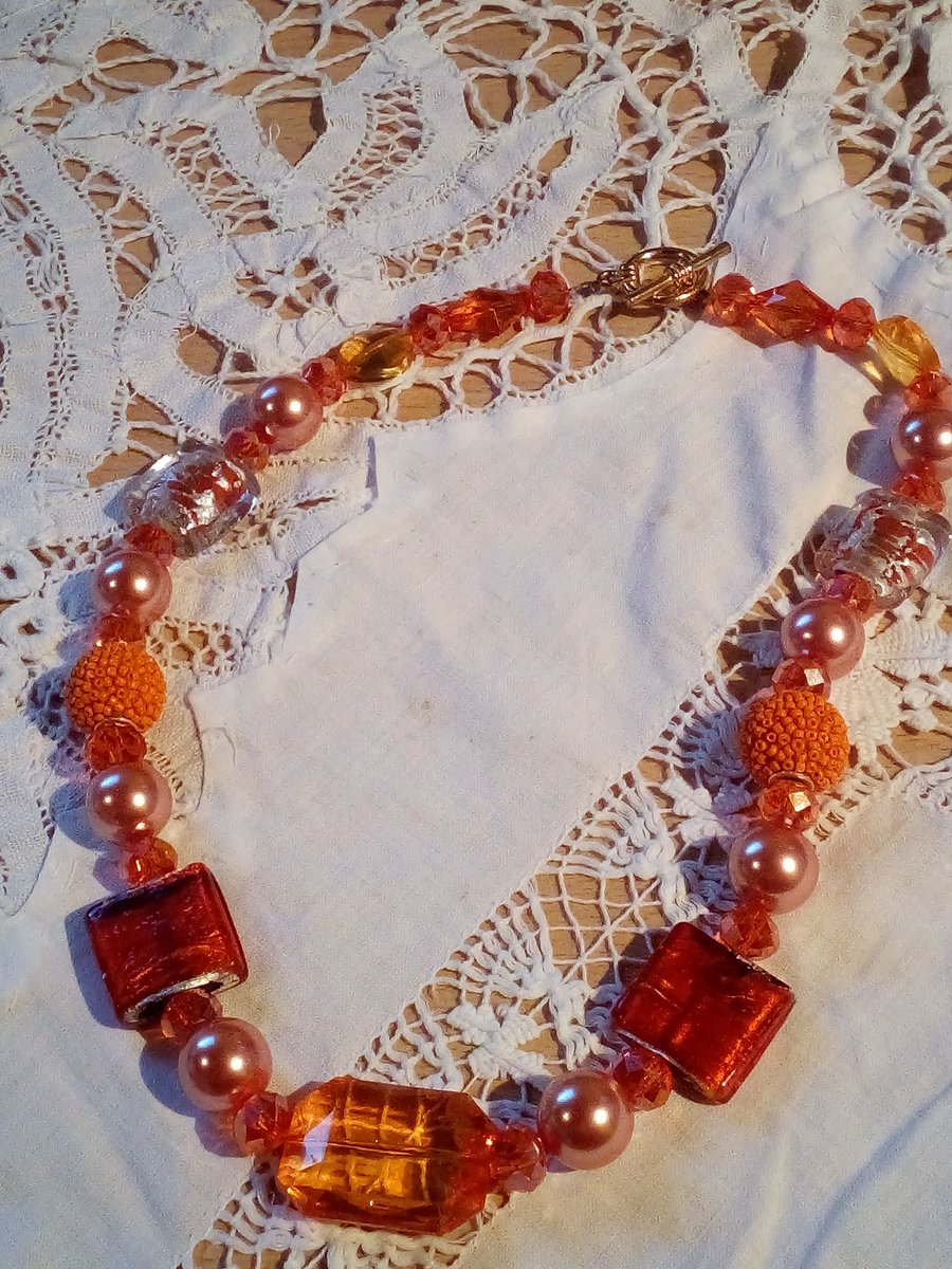 Hot tango necklace with mixed shades of orange beads