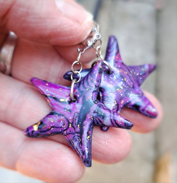 Funky pair of bright purple, black and gold leaf star earrings