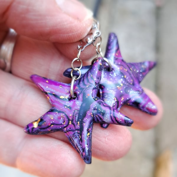 Funky pair of bright purple, black and gold leaf star earrings