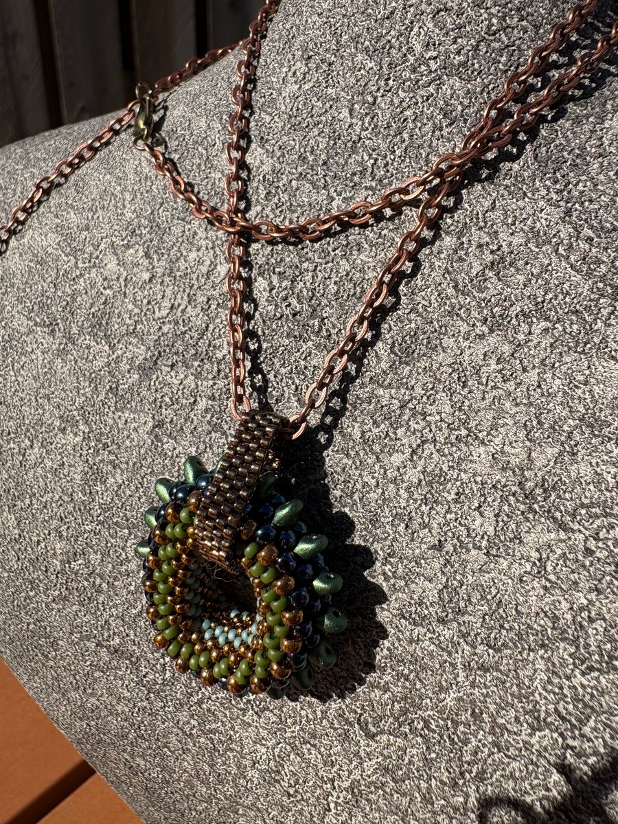 Spiky beaded donut pendant