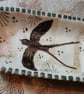 Square slip ware dish with hand painted swift design