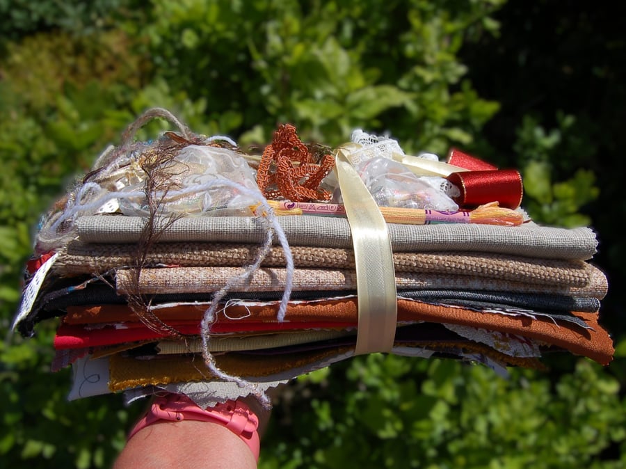 Upcycled slow stitching kit includes fabric, buttons, thread, lace, ribbon