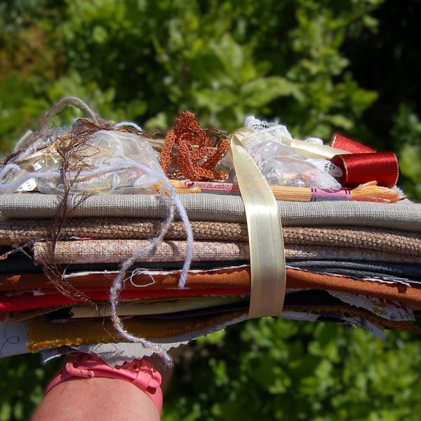 Upcycled slow stitching kit includes fabric, buttons, thread, lace, ribbon