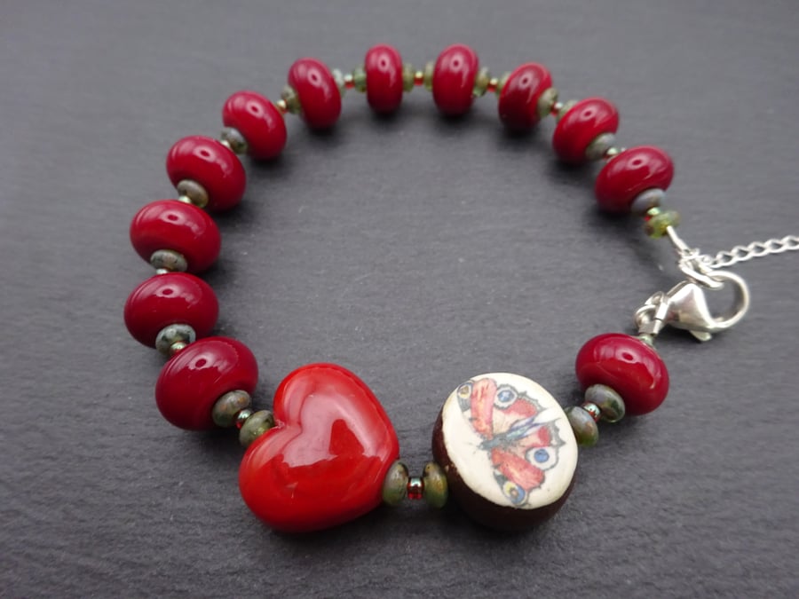 red lampwork glass bracelet, ceramic peacock butterfly jewellery