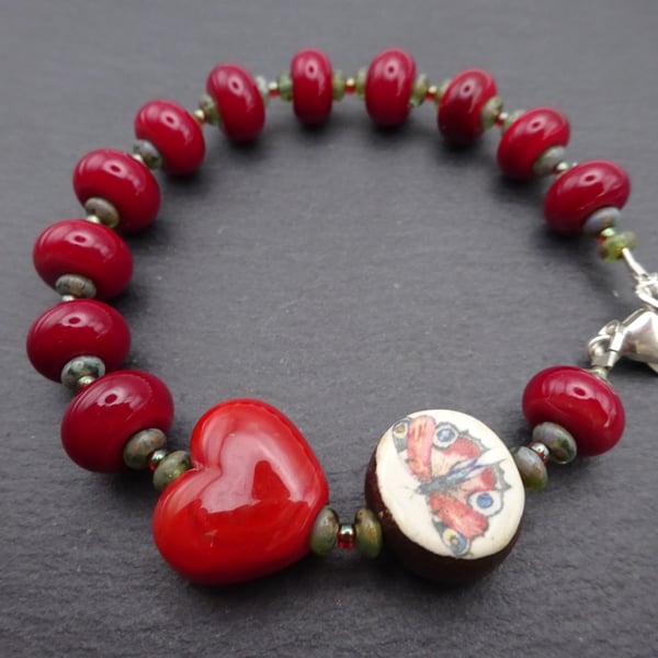 red lampwork glass bracelet, ceramic peacock butterfly jewellery