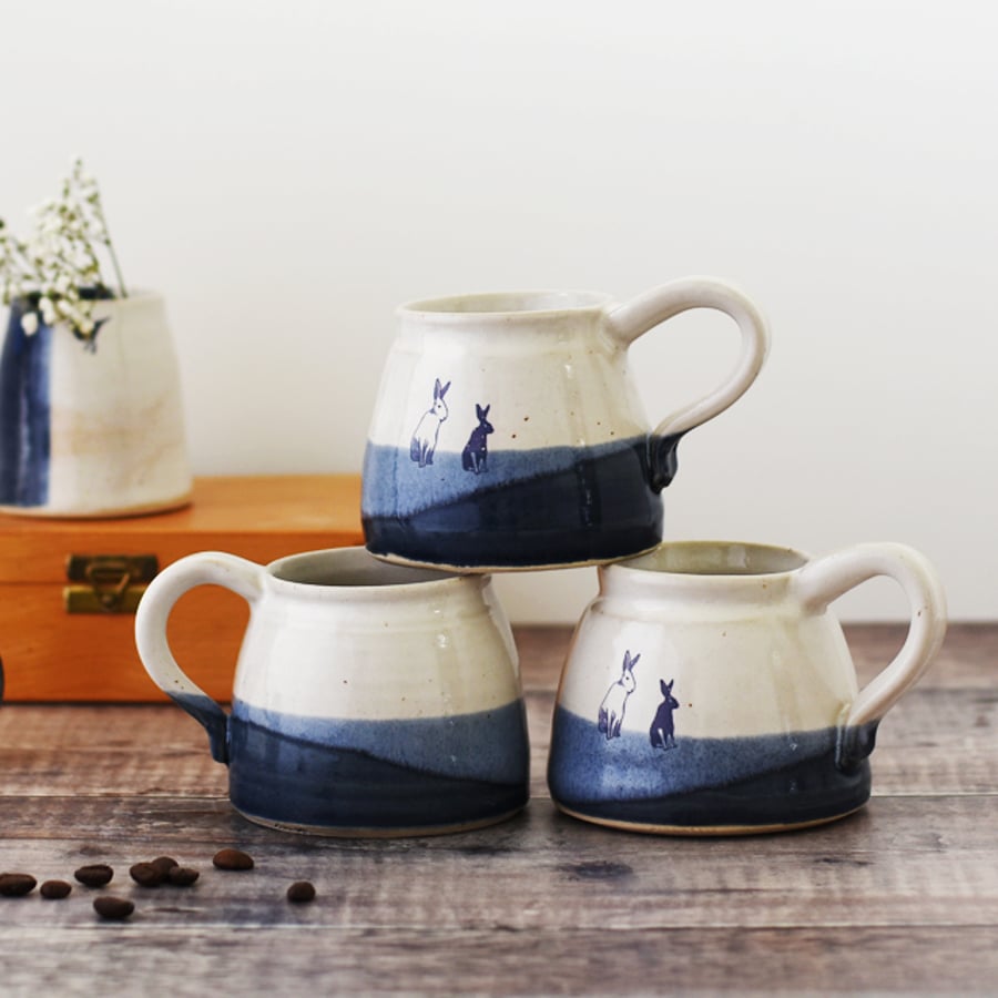 Handmade ceramic rabbit bunny mug glazed in blue and white - illustrated pottery