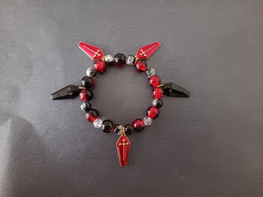 Elasticated beaded red and black gothic bracelet with coffin charms 