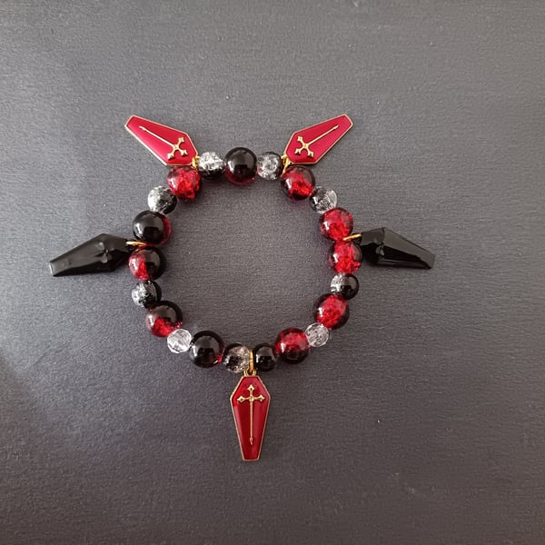 Elasticated beaded red and black gothic bracelet with coffin charms 
