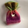 Unique multi coloured knitted gift bag with silver butterfly