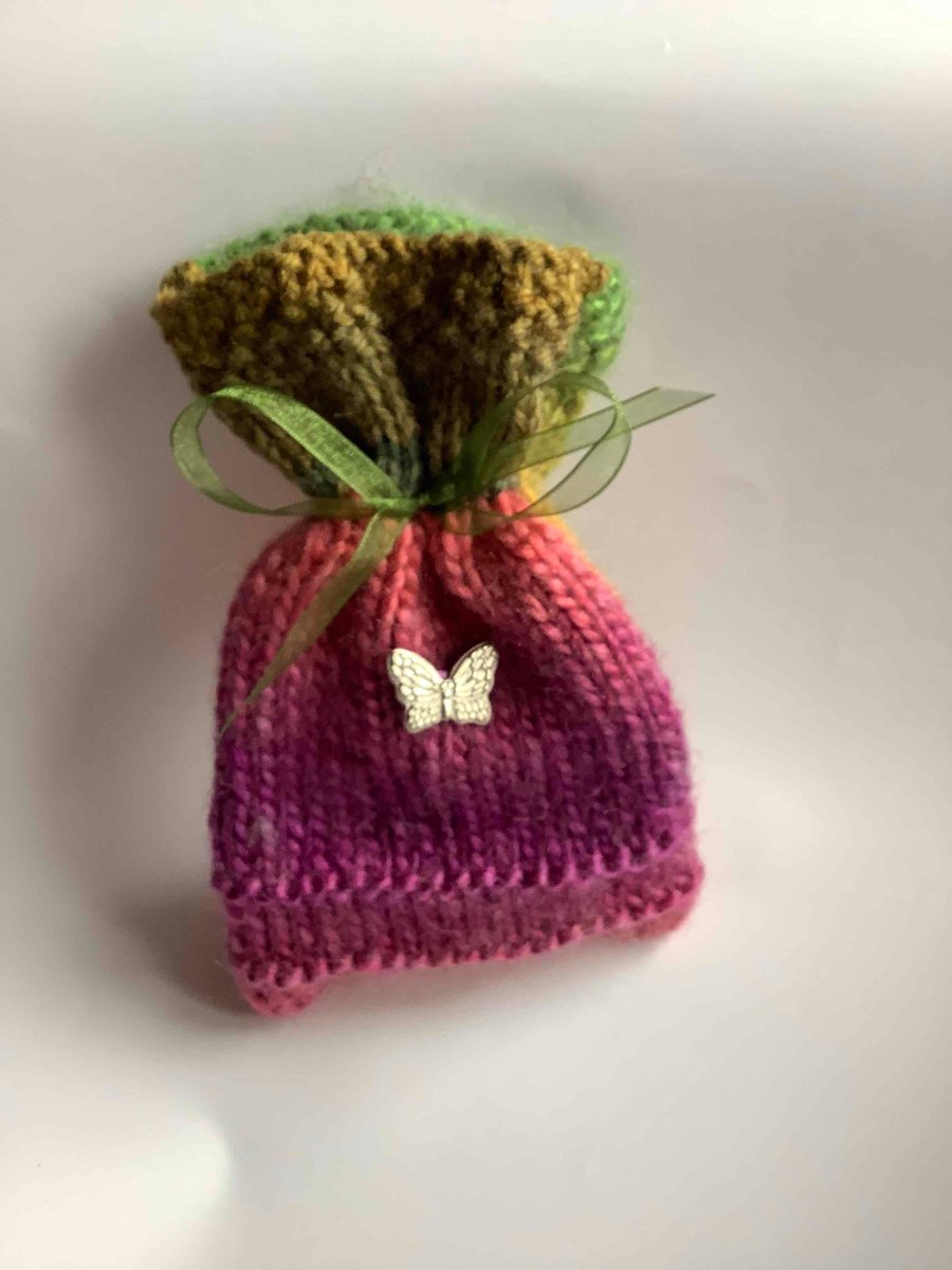 Unique multi coloured knitted gift bag with silver butterfly
