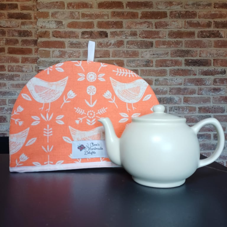 Tea Cosy in Burnt Orange coloured Narvik Birds Fabric