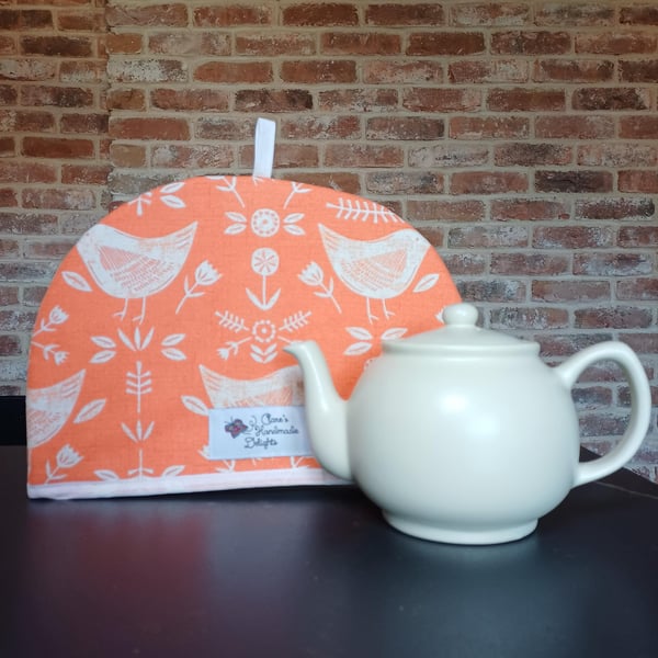 Tea Cosy in Burnt Orange coloured Narvik Birds Fabric