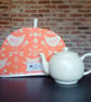 Tea Cosy in Burnt Orange Narvik Birds Fabric