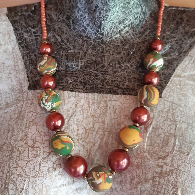  Statement necklace in mustard, red and sage