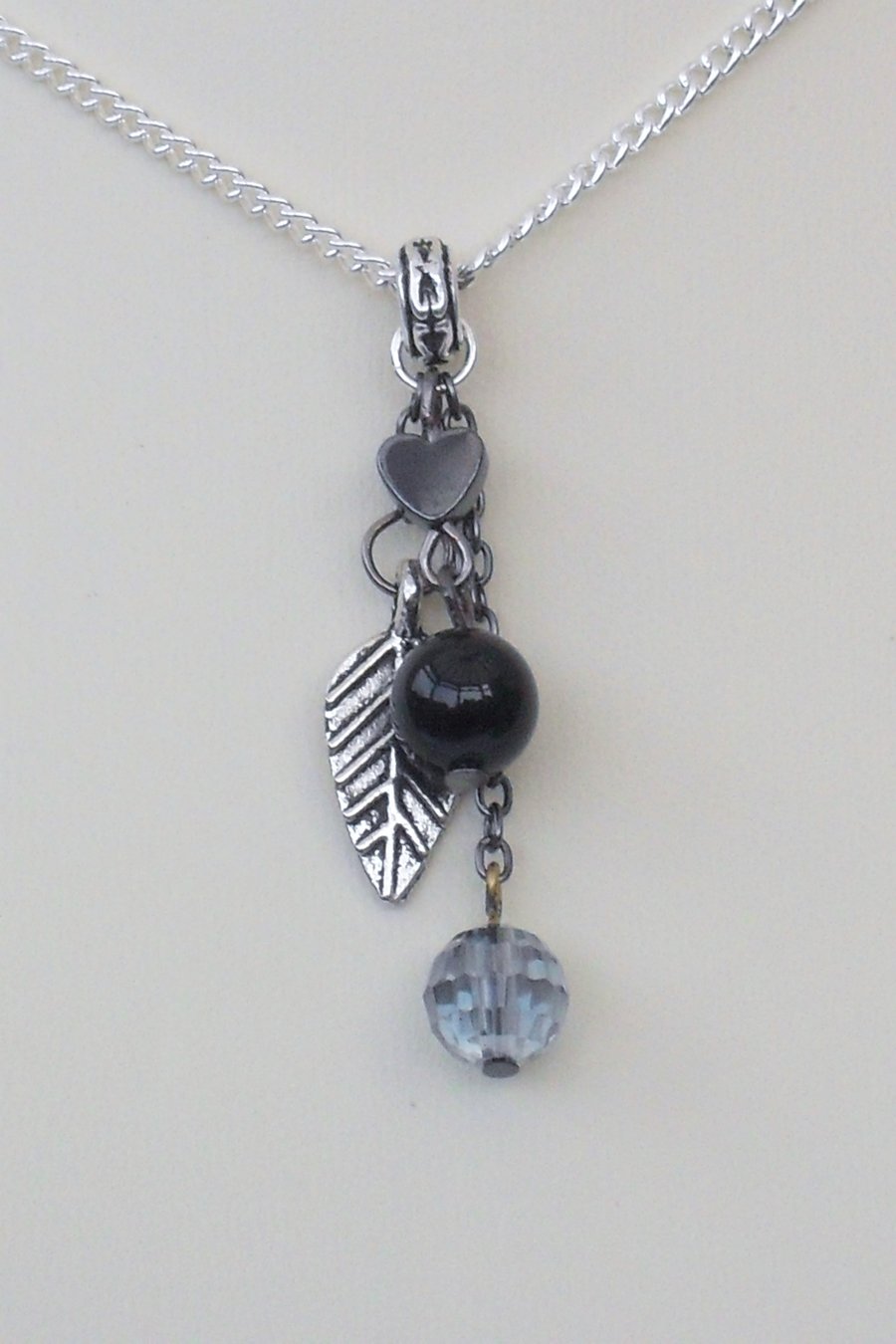 Leaf charm necklace - with black onyx, blue crystal & hematite