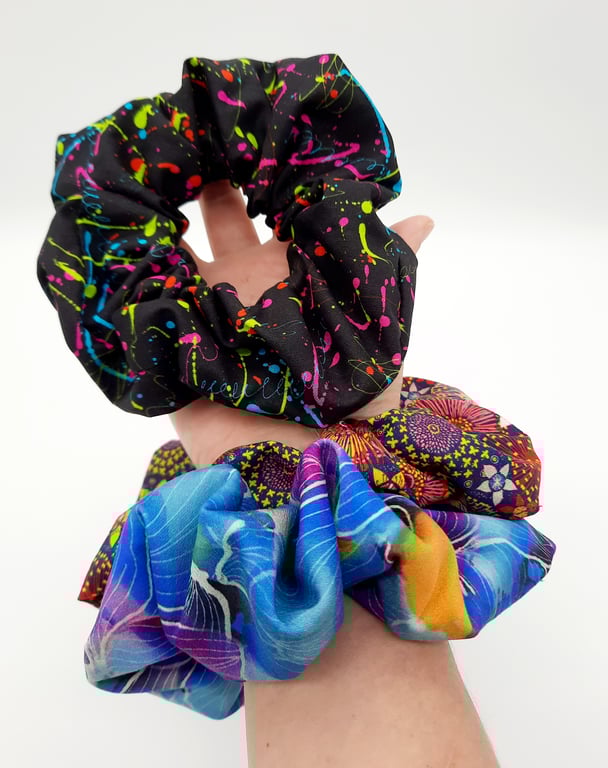 Large scrunchies,  set of 3. Black neon, blue petal fabric.  